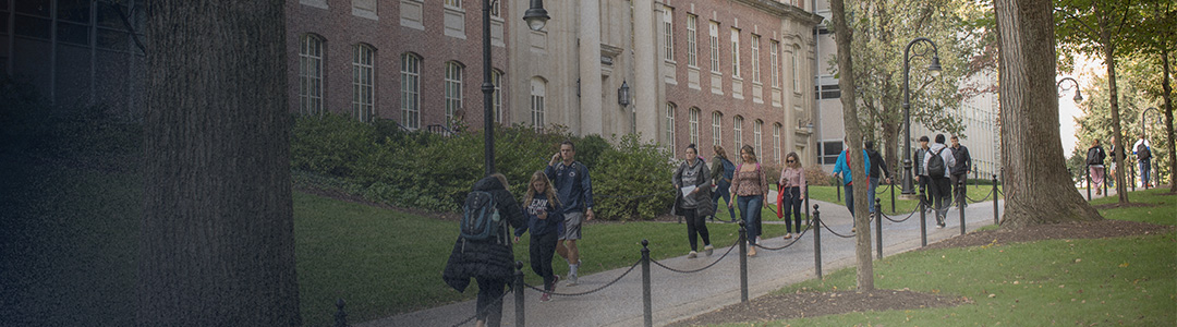 people walking in front of a building