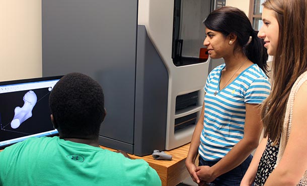 students using a 3-d printer